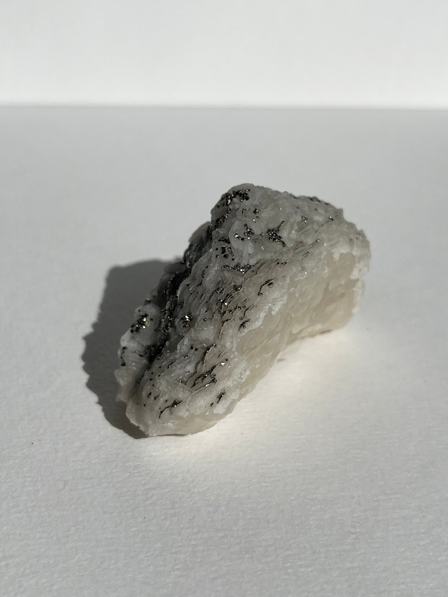 Pyrite Dusted Pink Coin Calcite Specimen (UV Reactive)